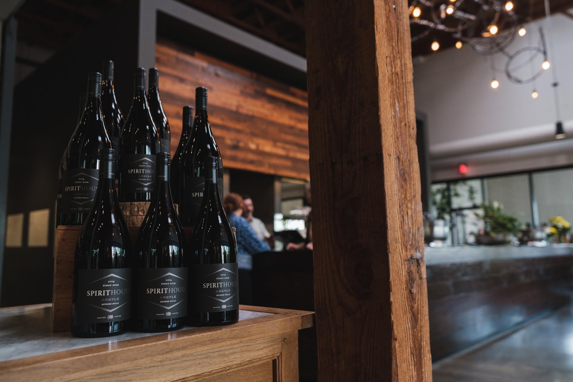 Bottles of Argyle Spirithouse wine on a wooden counter in the Tasting House