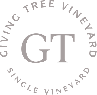 Logo of Giving Tree Vineyard. The logo features the initials 